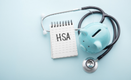 HSA notebook, stethoscope and piggy bank